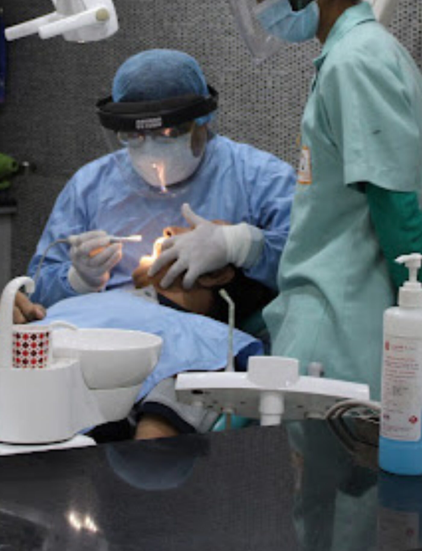 Dr. Rohit Batra treating a patient at Perfect 32 Dental Clinic
