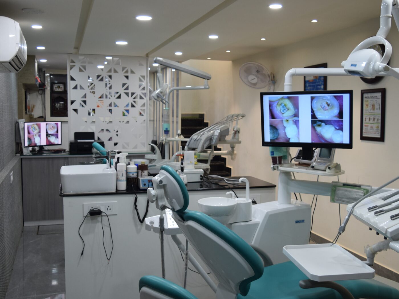 Treatment room with dental chair and intra-oral camera display